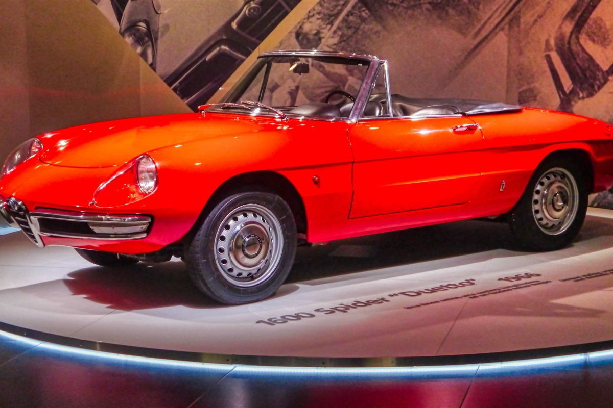 Red Alfa Romeo 1600 Spider Duetto on museum turntable