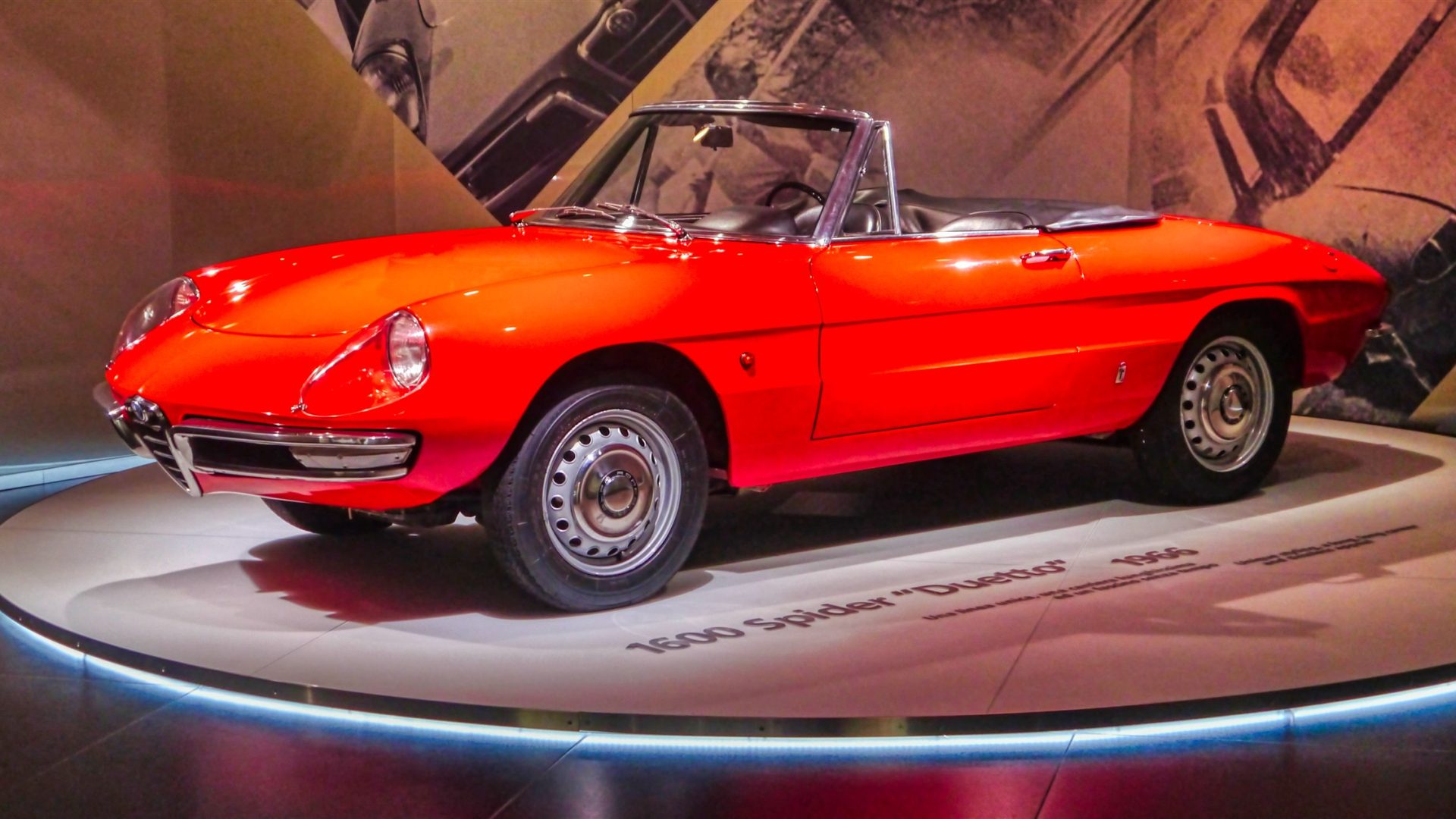 Red Alfa Romeo 1600 Spider Duetto on museum turntable